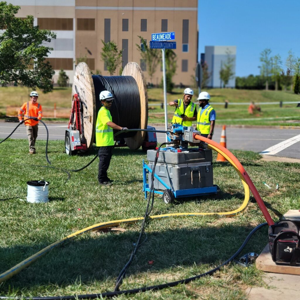 group of men installing fiber cable