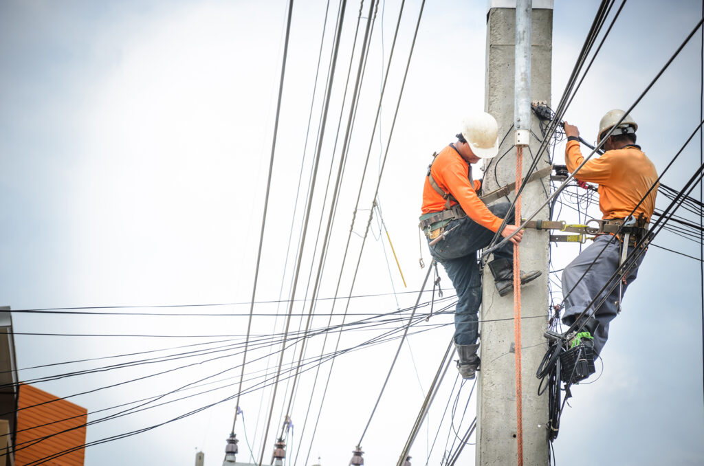 power line workers at a job site