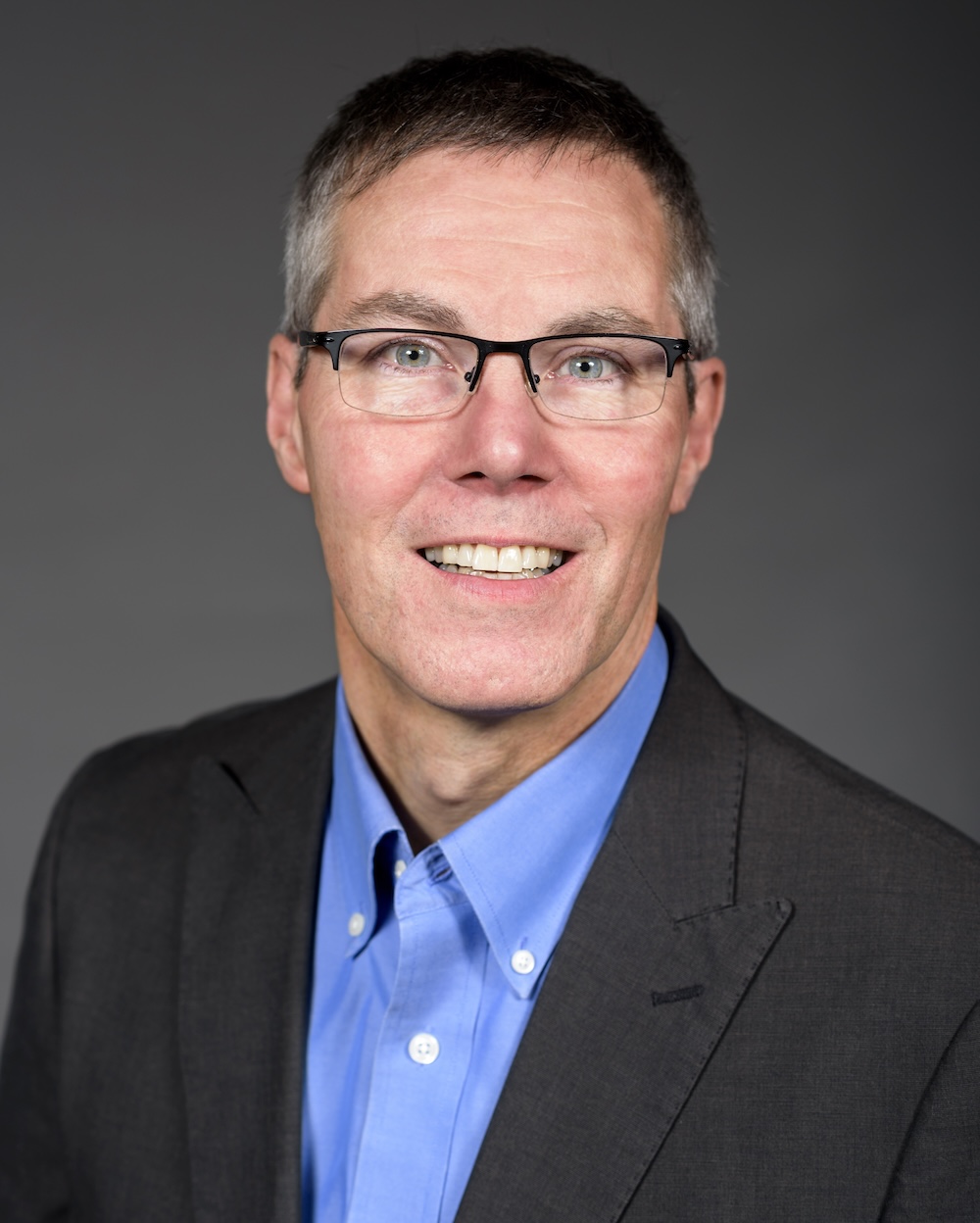 a headshot photograph of John Thalheimer